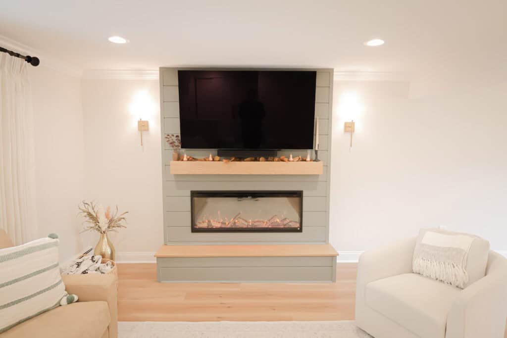 A fireplace with a tv above it.