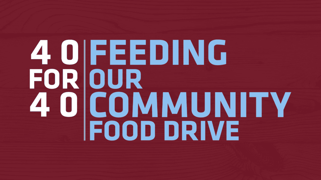 White and blue text on a maroon background reads: “40 for 40 Feeding Our Community Food Drive.” The background features a subtle wood grain pattern.