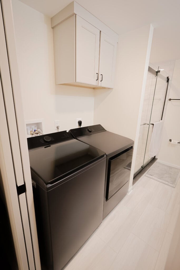 Washer and dryer in a contemporary laundry room setup.