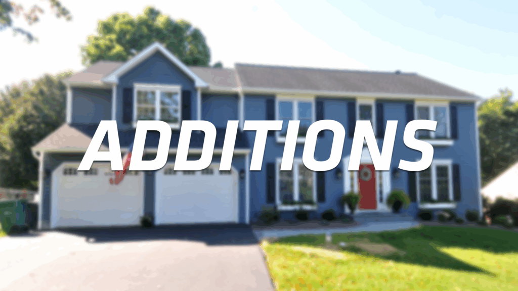 A large blue suburban house with a bright red door, a green lawn, and the word “ADDITIONS” in bold, white letters across the center.