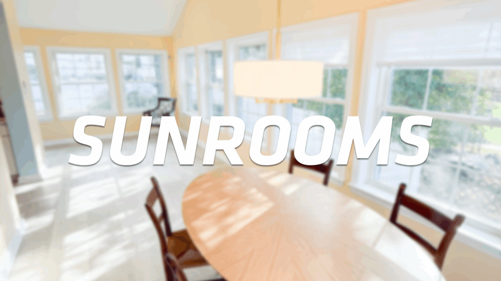 A bright sunroom with large windows, a round wooden dining table, and several chairs. Soft sunlight fills the space. The word SUNROOMS is written in bold white letters across the image.
