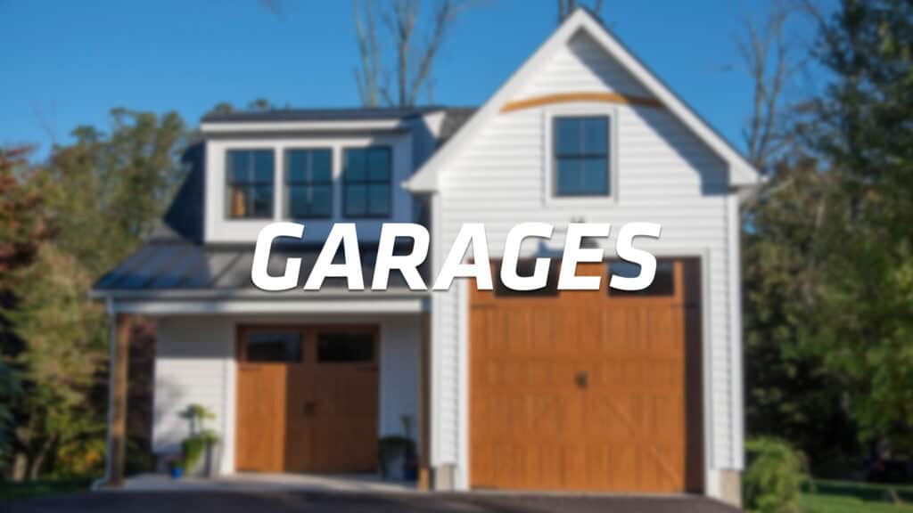 A white house with two wooden garage doors and large windows, surrounded by trees, with the word GARAGES in bold white letters across the center of the image.