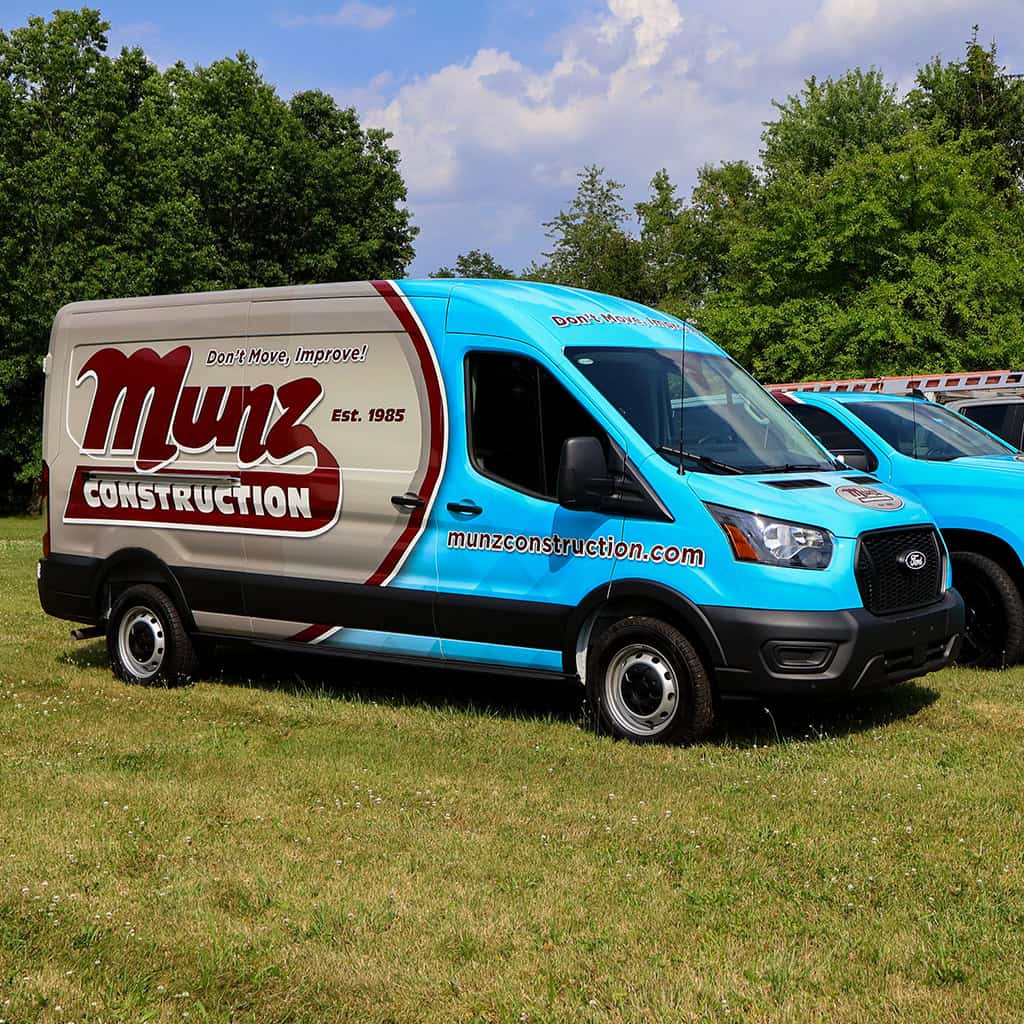 Munz Construction service van with company branding and website.