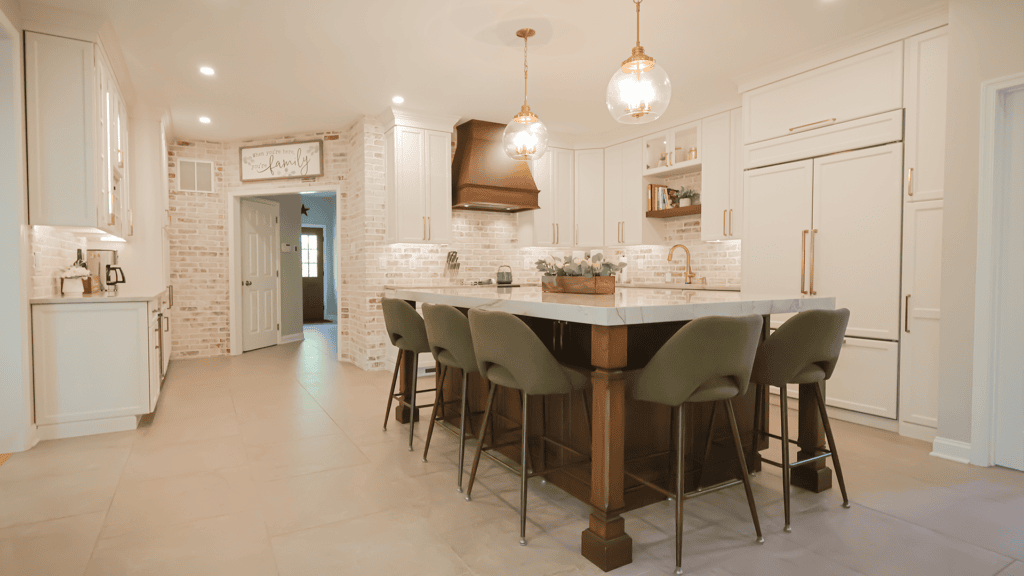 Spacious modern kitchen with island and pendant lighting by Munz Construction.